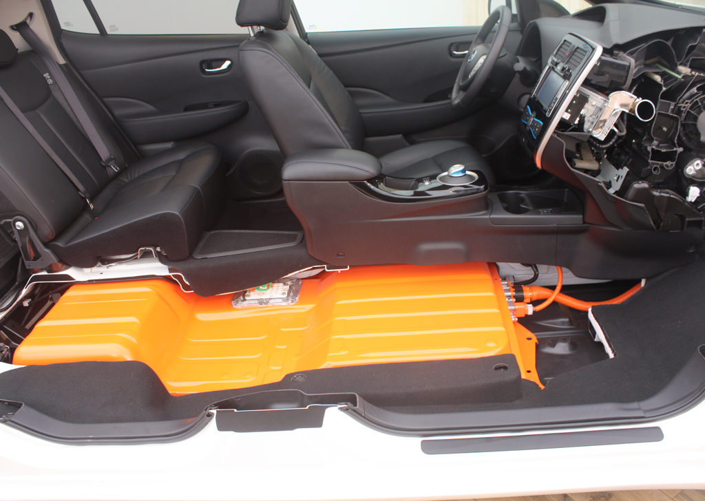 The battery in the Nissan Leaf is mounted under the floor, resulting in a low center of gravity and excellent handling. (Source: "2013 Nissan Leaf cutaway (2)" by Norsk Elbilforening, Licensed under CC BY 2.0 via Wikimedia Commons)